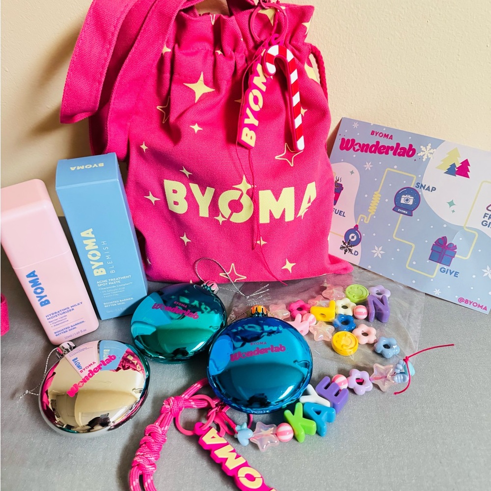 BYOMA Pink Drawstring Bag with Holiday merch